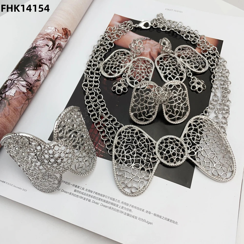 Silver jewelry set on a magazine page