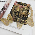 Gold necklace and earrings on a magazine page