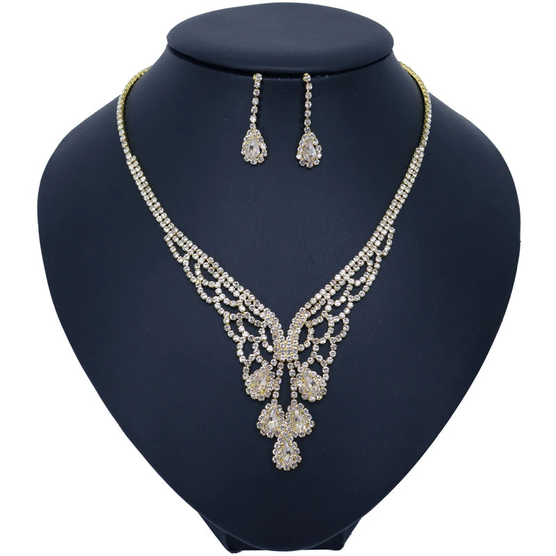 Jewelry set with necklace and earrings on a black mannequin bust