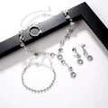 Silver jewelry set including necklace, bracelet, and earrings on a white background