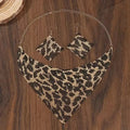 Jewelry set with necklace and earrings on a wooden surface