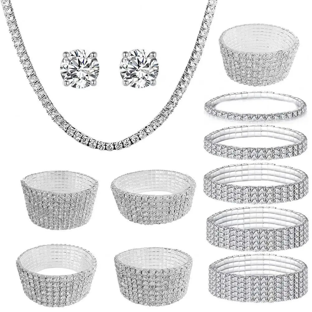 Silver jewelry set including necklace, earrings, and bangles on a white background