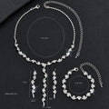 Silver jewelry set with necklace, earrings, and bracelet on a black background with measurements.