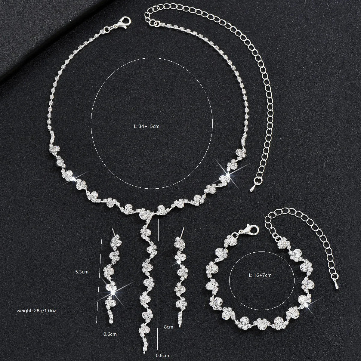 Silver jewelry set with necklace, earrings, and bracelet on a black background with measurements.
