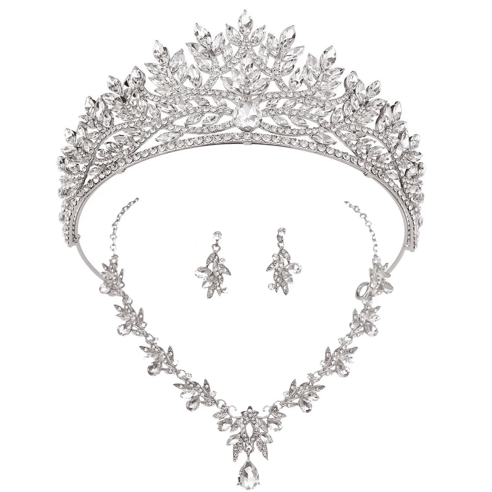 Silver tiara, necklace, and earrings set on a white background