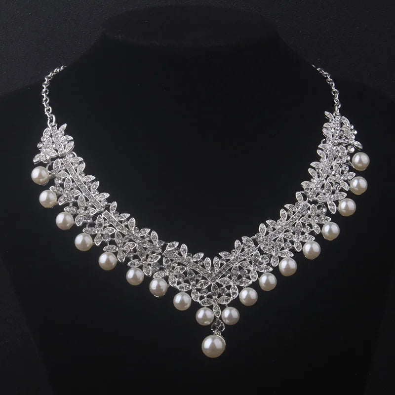 Pearl and crystal necklace on a black background
