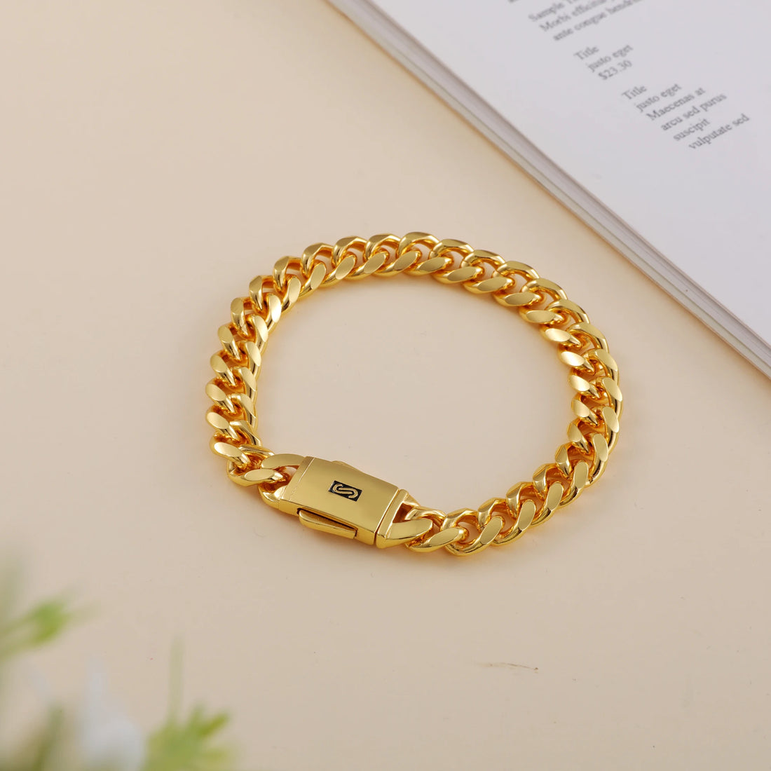 Gold jewelry set including necklace, bracelet, and earrings on a white background