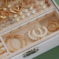 Jewelry box with gold and pearl earrings