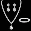 Jewelry set with necklace, earrings, and bracelet on a black background