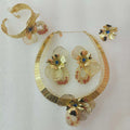 Gold jewelry set with necklace, bracelet, and earrings on a white background