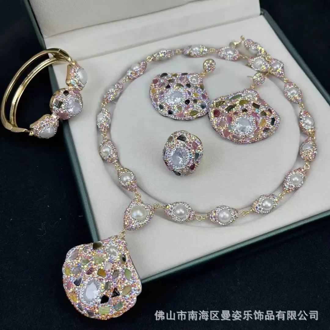 Jewelry set with necklace, earrings, and ring on a black background