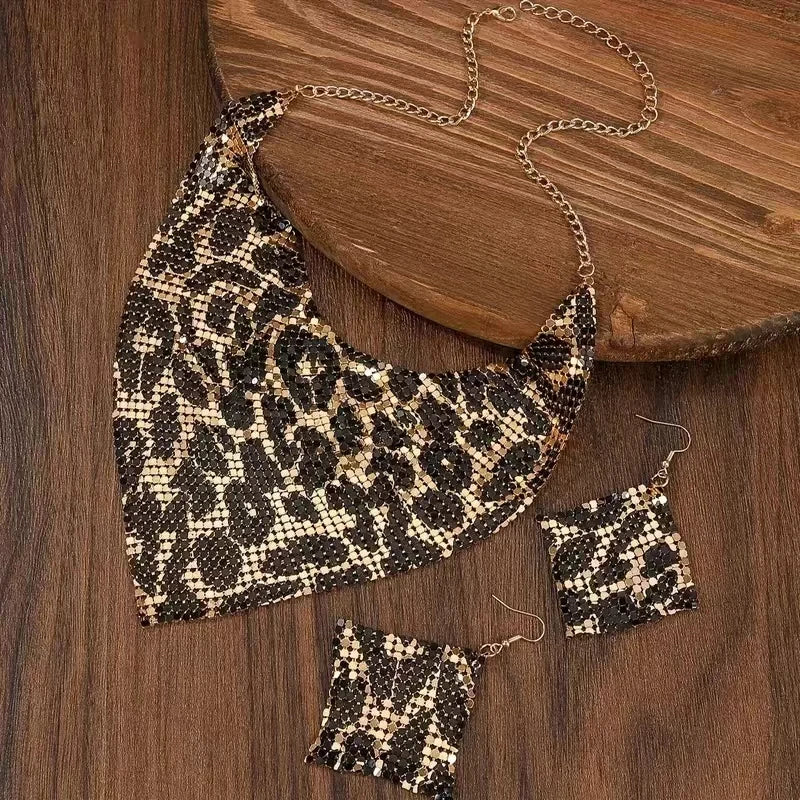 Leopard print necklace and earrings on a model against a neutral background