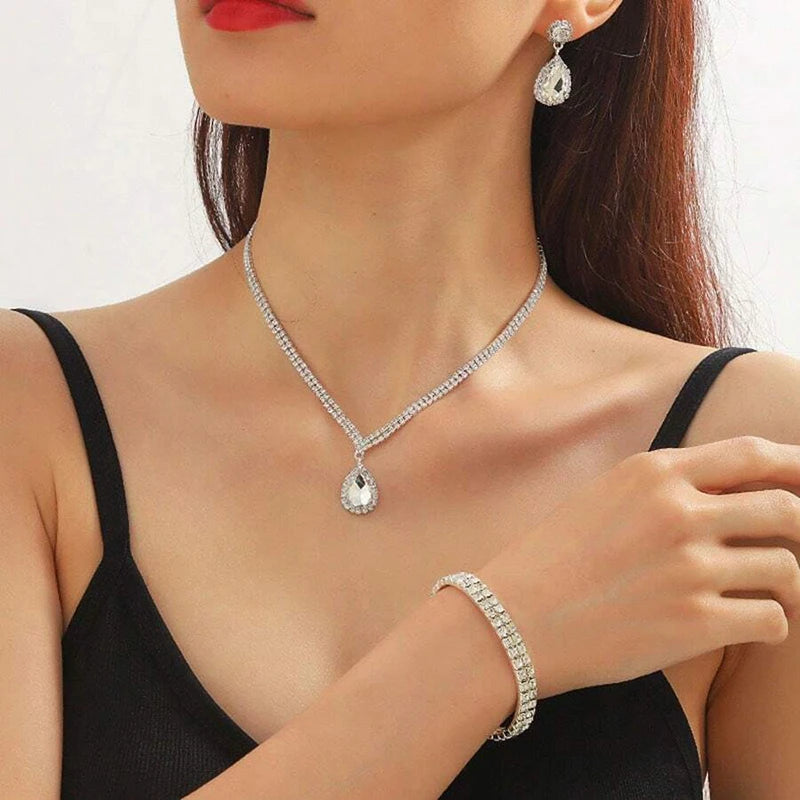 Jewelry set with necklace, earrings, and bracelet on a black background