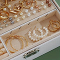 Jewelry box with gold and pearl earrings