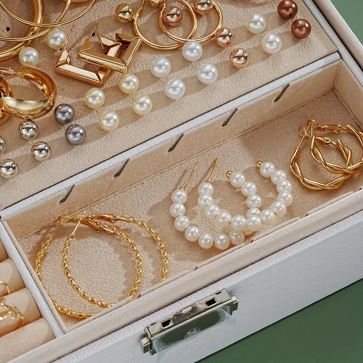 Jewelry box with gold and pearl earrings
