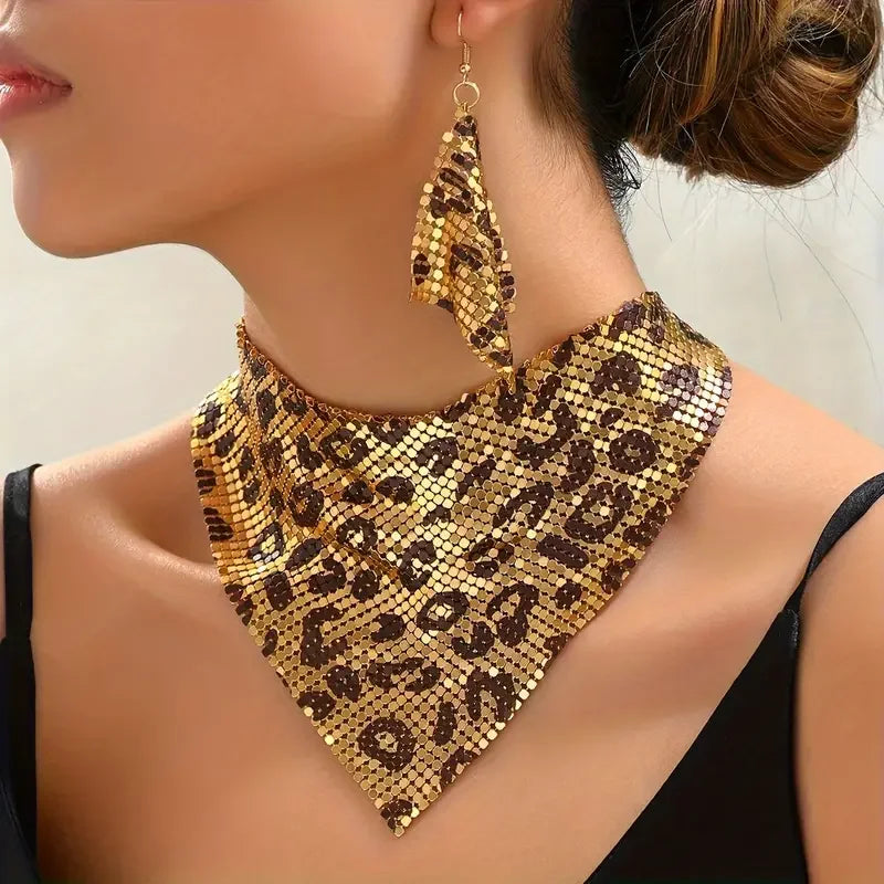 Leopard print necklace and earrings on a model against a neutral background