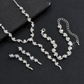 Silver jewelry set with necklace and bracelet on a black background