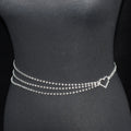 Silver chain belt with heart clasp on a black mannequin