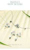 Jewelry set with 'The Wizard of Oz' theme on a light background