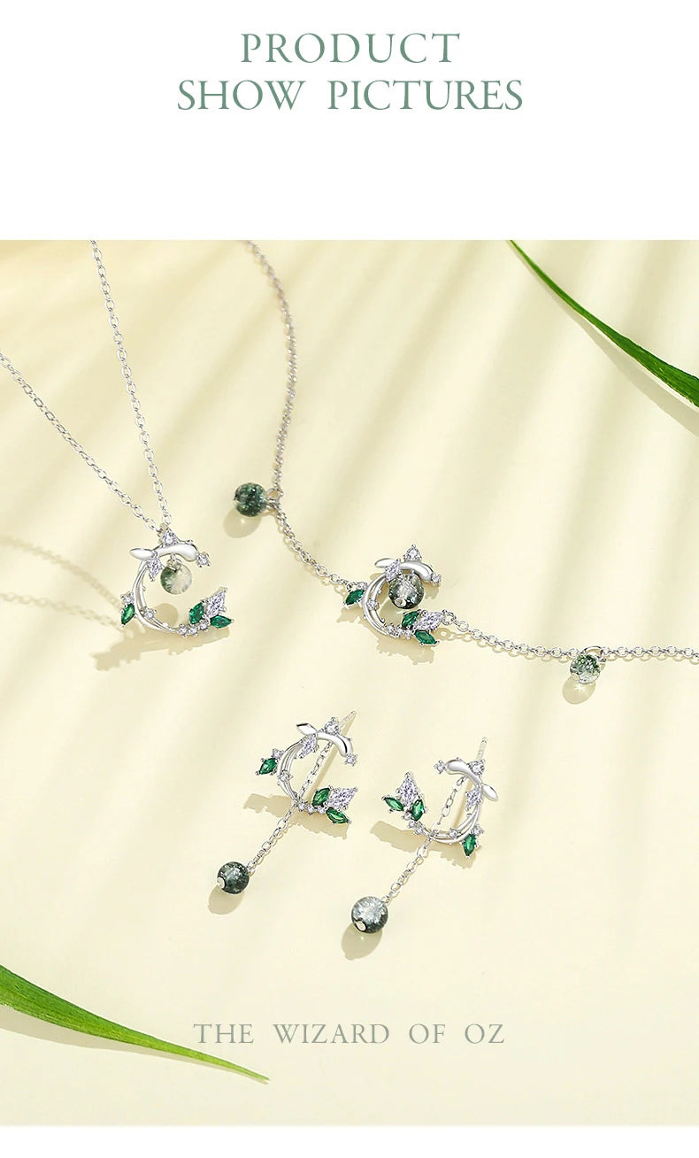 Jewelry set with 'The Wizard of Oz' theme on a light background