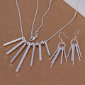 Silver necklace and earrings set on a brown background