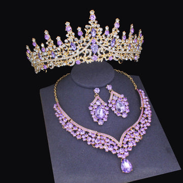 Purple gemstone tiara, necklace, and earrings set on a black background